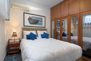 מיטה או מיטות בחדר ב-Villa Haraki Paradise