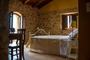 En eller flere senge i et værelse på Agriturismo Casale Ré