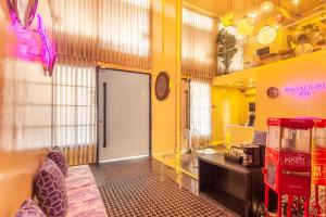 a room with a door and a yellow wall at Hotel Living 55 in Bogotá