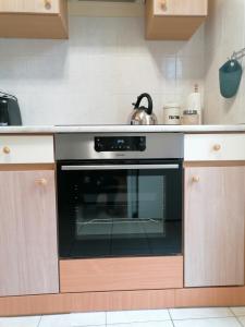 Kuchyňa alebo kuchynka v ubytovaní Szamóca Apartman