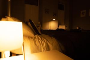 Posteľ alebo postele v izbe v ubytovaní Soho Apartments Lviv