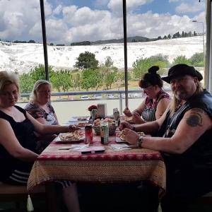 a group of people sitting at a table eating food at Alida Hotel in Pamukkale