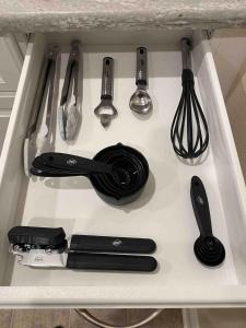 a drawer full of kitchen utensils on a shelf at Balmoral in Santa Clara