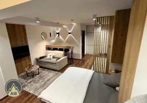 A bed or beds in a room at Lux Apartman A18 & SPA Centar