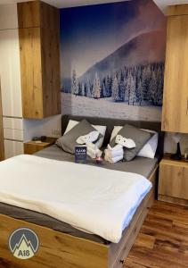 A bed or beds in a room at Lux Apartman A18 & SPA Centar