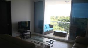 Televisyen dan/atau pusat hiburan di Panoramic Ocean view Playa Blanca Suite