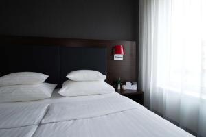 Ein Bett oder Betten in einem Zimmer der Unterkunft Best Western Plus Plaza Hotel Graz
