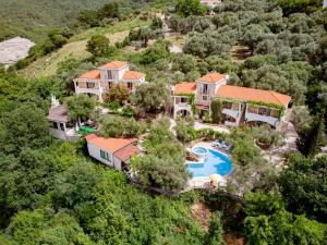 an aerial view of a house with a swimming pool at Resort "Maslinjak" in Budva