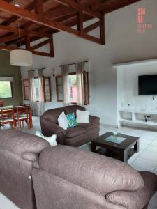 a living room with two couches and a table at Puerta 1910 in Tunuyán