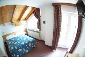 Postel nebo postele na pokoji v ubytování Hotel Sciatori