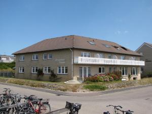 a building with bikes parked in front of it at Strandhotel-Najade in Borkum
