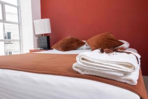 Postel nebo postele na pokoji v ubytování Zuruma Hotel