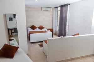 Postel nebo postele na pokoji v ubytování Zuruma Hotel