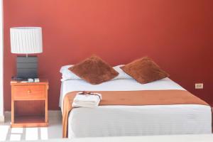 Postel nebo postele na pokoji v ubytování Zuruma Hotel