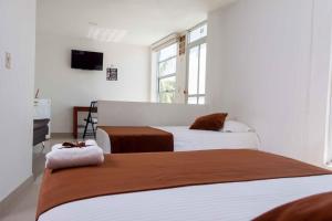 Cama o camas de una habitación en Zuruma Hotel