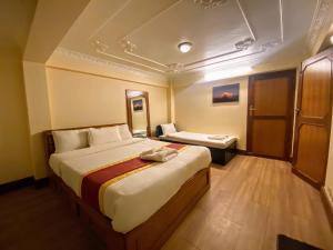 Tempat tidur dalam kamar di Hotel Bodhiz