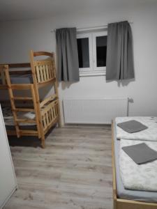 Posteľ alebo postele v izbe v ubytovaní Apartmány PRO LIPNO