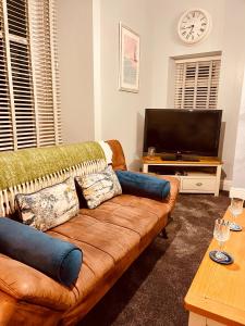 Телевизор и/или развлекательный центр в Beach Retreat