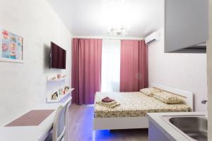 En eller flere senge i et værelse på Metalist stadium district