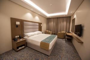 Letto o letti in una camera di ROZANA HOTEL