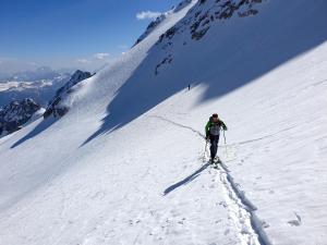 a man is skiing down a snow covered mountain at Garni Hotel Bel Vert in Selva di Val Gardena