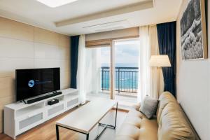 TV a/nebo společenská místnost v ubytování Risen Ocean Park Hotel