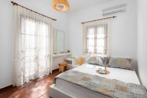Postel nebo postele na pokoji v ubytování Maravelia Mare + 15 fotografií