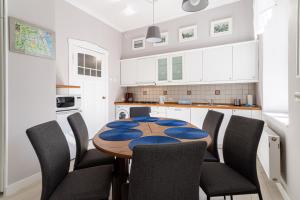 Kuchyňa alebo kuchynka v ubytovaní Victus Apartamenty, Apartament Grand