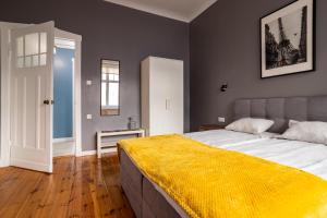Posteľ alebo postele v izbe v ubytovaní Victus Apartamenty, Apartament Grand