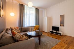 Televízia a/alebo spoločenská miestnosť v ubytovaní Victus Apartamenty, Apartament Grand