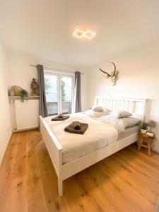 Ένα ή περισσότερα κρεβάτια σε δωμάτιο στο Ferienwohnung am Inn