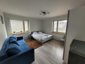 Posteľ alebo postele v izbe v ubytovaní Apartamenty Promyk Wisełka