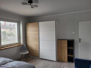 Posteľ alebo postele v izbe v ubytovaní Apartamenty Promyk Wisełka + 37 fotografií
