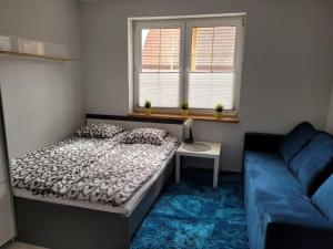 Posteľ alebo postele v izbe v ubytovaní Apartamenty Promyk Wisełka
