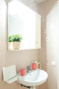 a bathroom with a white sink and a window at Residencia Universitaria Sant Jordi in Tarragona