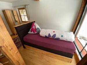 A bed or beds in a room at Chalet Sodamin Alpin mit Wellness