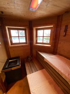 A bed or beds in a room at Chalet Sodamin Alpin mit Wellness