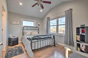 a bedroom with a bed and a ceiling fan at Third-Floor Chicago Condo Walk to CTA Stations! in Chicago