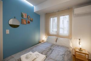 Posteľ alebo postele v izbe v ubytovaní Calliope Apartment