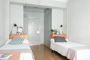 Postel nebo postele na pokoji v ubytování Residencia Universitaria Resa Sant Jordi