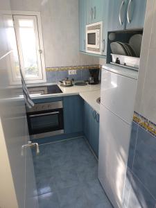 A kitchen or kitchenette at IRiS DEL MAR
