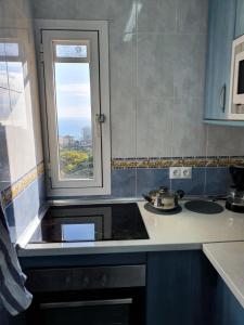 A kitchen or kitchenette at IRiS DEL MAR