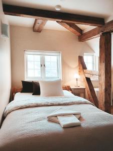 מיטה או מיטות בחדר ב-Kupfernams