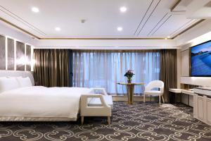 Postel nebo postele na pokoji v ubytování Nanjing Central Hotel