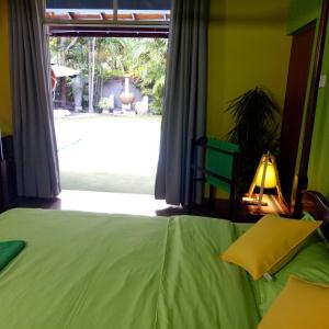 Postel nebo postele na pokoji v ubytování Palms Villa