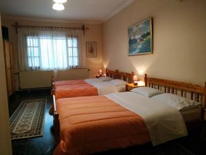 เตียงในห้องที่ Pension Vergina