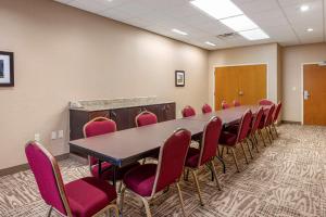 a conference room with a long table and chairs at Comfort Inn Louisville Southwest in Louisville +18 photos
