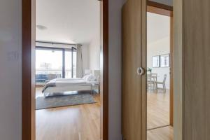 Posteľ alebo postele v izbe v ubytovaní JT's Apartments Korunní str.