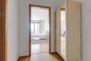 Posteľ alebo postele v izbe v ubytovaní JT's Apartments Korunní str.
