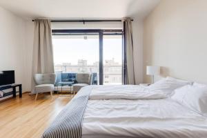 Posteľ alebo postele v izbe v ubytovaní JT's Apartments Korunní str.